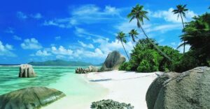 Introduction Sun, sand, and salty air call to millions of travelers every year. Beach trips help you relax and forget daily stress. The world offers many stunning shores, but choosing the right one can feel tough. This guide covers the top beach vacation destinations you must visit in 2026. From tropical islands to lively coastal towns, each spot brings something unique. Some places offer luxury resorts. Others give you wild nature and quiet coves. You will find options for couples, families, and solo travelers here. We picked spots based on beauty, activities, food, and traveler reviews. Get ready to plan your dream beach trip. Why People Love the Top Beach Vacation Destinations Beaches offer more than just pretty views. They bring peace to your mind and body. The sound of waves helps you sleep better. Warm sun boosts your mood and gives you vitamin D. Swimming and snorkeling keep you fit while having fun. The top beach vacation destinations also mix culture with nature. You can taste local food and meet friendly people. Many beach towns host fun events like music nights and food fests. Kids love building sandcastles and chasing crabs. Couples enjoy sunset walks and romantic dinners. Money matters too. Some beach spots cost less than city trips. You can find cheap hotels near the sand. Many beaches are free to visit. You just need travel costs and food money. Plus, beach gear like towels and sunscreen is easy to pack. That's why beach trips remain the top choice for holidays worldwide. Maldives: Paradise Among the Top Beach Vacation Destinations The Maldives sits in the Indian Ocean south of Sri Lanka. This island country ranks high on every list of top beach vacation destinations. It has over 1,000 coral islands grouped into 26 atolls. Each resort often takes up one full island, giving guests total privacy. Overwater villas are the star attraction here. You sleep on a pier above clear blue water. Some rooms have glass floors where you can watch fish swim. The sand is soft and white like sugar. Waters glow in shades of blue and green. Scuba diving in the Maldives feels magical. Divers see sharks, rays, and colorful fish. Snorkeling right off your villa is common. You can also enjoy spa treatments, sunset cruises, and fresh seafood. Summer months bring some rain but great diving conditions. The best time to visit is November through April. Many honeymooners pick the Maldives for its calm and dreamy vibe. Bora Bora: French Polynesia's Crown Jewel Bora Bora shines as one of the most romantic top beach vacation destinations on Earth. It sits in the South Pacific in French Polynesia. Mount Otemanu towers over the island, giving you epic photo spots. The lagoon around Bora Bora looks like liquid turquoise. Matira Beach stands out as the best public beach here. Its soft white sand stretches for miles. You can snorkel right from the shore and see turtles and reef fish. Le Meridien Beach hosts a turtle sanctuary that visitors love. The island offers many fun things to do. You can take helicopter rides over the lagoon. Sightseeing boats take you around Mount Otemanu. Some tours let you swim with sharks and rays in safe spots. Sunset catamaran cruises are a must for couples. Bora Bora feels less crowded than the Maldives. Small towns nearby let you shop and eat outside your resort. The best time to visit is from May to October when the weather stays dry and calm. Bali: Budget-Friendly Beach Bliss Bali is Indonesia's most famous island. It sits west of Java in the Lesser Sunda Islands. Bali is one of the most budget-friendly top beach vacation destinations in the world. A 5-star resort here often costs half the price of one in the Maldives. The island offers a mix of beach fun and rich culture. Kuta Beach is great for surfing and nightlife. Nusa Dua has calm waters perfect for families. Sanur Beach draws travelers who want a quiet vibe. Uluwatu Temple sits on a cliff with amazing ocean views. Water sports are big here. You can try surfing, diving, snorkeling, and kitesurfing. The Bali Marine and Safari Park hosts exotic animals like the Komodo dragon. Hidden waterfalls in the jungle make great day trips. Bali also serves tasty food at low prices. Local markets sell teak and bamboo crafts. Solo travelers, couples, and families all love this island. Its warm vibe and friendly locals make you feel at home fast. Maui: Hawaii's Beach Gem in the USA Maui remains one of the top beach vacation destinations for American travelers. This Hawaiian island has diverse beaches and lush landscapes. You get golden sands, black sand shores, and clear blue waters all in one place. Wailea offers luxury resorts and calm swimming beaches. Makena Cove is a hidden spot loved for its romantic feel. Black Rock and Honolua Bay are famous for snorkeling in super clear water. You will spot turtles, tropical fish, and coral reefs here. The Road to Hana is a scenic drive you must take. It passes waterfalls, rainforests, and cliff views. You can also catch sunrise from Haleakalā National Park. The view above the clouds feels unreal. Maui suits every kind of traveler. Couples find romance easily. Families enjoy safe beaches and fun tours. Adventure seekers get hikes, surf spots, and helicopter rides. Renting a car is the best way to explore the island fully. Seychelles: Nature's Untouched Beauty The Seychelles archipelago floats in the Indian Ocean off East Africa. It joins the list of top beach vacation destinations because of its wild beauty. The islands mix lush green forests with massive granite rocks and sheltered coves. Anse Source d'Argent on La Digue island is world-famous. Huge pink boulders sit on white sand next to shallow blue water. The beach looks like something from a fantasy movie. Praslin Island hosts Anse Lazio, another top-rated shore. Wildlife lovers will feel excited here. You can see giant tortoises, rare birds, and coral reefs. The Vallée de Mai forest holds the unique coco de mer tree. Snorkeling and diving reveal colorful marine life. Most visitors can get a visa on arrival. That makes trip planning easy. The Seychelles suits honeymooners, families, and nature fans. It offers luxury without the crowds you find in other tropical spots. Peak season runs from April to October. Top Beach Vacation Destinations in the USA You don't need a passport to reach some amazing shores. The USA hosts many of the top beach vacation destinations in the world. These spots suit road trips, family holidays, and short getaways. La Jolla Cove in California topped the U.S. list for 2026. It sits in a marine sanctuary with clear water and sea lions on the rocks. Swimmers, kayakers, and snorkelers love this spot. Florida offers many top choices. Clearwater Beach has soft white sand and calm Gulf waters. Key West gives you a laid-back island vibe with great food and sunsets. Panama City Beach draws families with its warm waters and fun boardwalks. Myrtle Beach in South Carolina is perfect for East Coast travelers. It has 60 miles of shoreline, mini-golf, and family-friendly hotels. Ocean City in Maryland offers a classic boardwalk vibe. Honeymoon Island State Park in Florida shows off natural beauty at its best. Best Time to Visit the Top Beach Vacation Destinations Timing your trip right saves money and gives better weather. Each of the top beach vacation destinations has its own peak and off-peak seasons. The table below shows the best months to travel. Destination Best Time to Visit Water Temp Season Type Maldives Nov – April 82–86°F Dry season Bora Bora May – October 79–84°F Dry season Bali April – October 82–86°F Dry season Maui April – May, Sep – Nov 75–80°F Shoulder Seychelles April – May, Oct – Nov 82–86°F Calm season Florida Keys March – May 78–84°F Warm & dry Myrtle Beach May – September 75–82°F Summer peak Off-peak trips often cost less. The Caribbean and Maldives feel cheaper in summer. Europe's beaches, like the Algarve and Sardinia, cost more from June to August. Budget Guide for the Top Beach Vacation Destinations Beach trips can fit any budget. Some top beach vacation destinations cost thousands per night. Others let you stay for under $50 daily. Planning helps you get the best deal. Bali and Cartagena offer great value. You can find nice hotels for $30 to $80 per night. Food costs stay low too. Southeast Asia stays cheap year-round for U.S. travelers. Luxury lovers should look at the Maldives, Turks and Caicos, and Bora Bora. Overwater villas often cost $800 to $3,000 per night. But you get top service, private beaches, and world-class food. Mid-range travelers can pick Maui, the Algarve in Portugal, and Milos in Greece. Hotels here run $150 to $400 per night. You get great beaches without breaking the bank. Budget Level Best Destinations Nightly Cost Budget Bali, Cartagena, Zanzibar $30 – $100 Mid-Range Maui, Algarve, Milos $150 – $400 Luxury Maldives, Bora Bora, Turks & Caicos $800 – $3,000 Book flights 3 to 6 months early for the best rates. Mediterranean hotels for July fill up by February. Tips for Planning the Top Beach Vacation Destinations Smart planning turns a good trip into a great one. Follow these tips when you book any of the top beach vacation destinations: Pack light but smart. Bring sunscreen, a hat, flip-flops, and swimwear. Add a reef-safe sunscreen to protect corals. Book activities early. Snorkel tours, boat rides, and spa sessions fill up fast in peak season. Check visa rules. Some countries offer a visa on arrival. Others need it in advance. Buy travel insurance. It covers flight delays, lost bags, and medical needs. Learn a few local words. A simple "hello" or "thank you" earns big smiles. Try local food. Beach towns serve the freshest seafood at low prices. Respect the environment. Don't touch coral, feed fish, or leave trash on beaches. Stay hydrated. Tropical heat drains your energy fast, so drink plenty of water. Talk to locals for hidden beach spots. They know quiet coves that tourists miss. This helps you enjoy calm shores without crowds. What Makes These the Top Beach Vacation Destinations Not every pretty shore makes the top list. Certain features push a beach from good to great. The top beach vacation destinations share a few key qualities. Clear water is a must. The best beaches show blue or green tones you can see through. Soft sand adds to the fun. Rough or rocky sand ruins beach walks and swim time. Safety matters too. Top beaches have lifeguards, calm currents, and clean water. Family-friendly spots also offer shallow areas for kids to play. Good food and hotels round out the deal. You need nearby cafes, markets, and comfy places to sleep. Beach towns with fun activities score high. Snorkeling, surfing, boat rides, and spa services add value. Culture also shapes the top picks. Places like Bali and Cartagena mix beach time with rich history. Locals welcome guests warmly and share their traditions. This human touch turns a simple trip into a lifetime memory. That's why these shores stay on top year after year. Frequently Asked Questions Q1: Which are the top beach vacation destinations in the world for 2026? The top choices for 2026 include Isla Pasion in Mexico, La Jolla Cove in California, the Maldives, Bora Bora, Bali, Maui, and the Seychelles. Tripadvisor named Isla Pasion the best beach in the world for 2026. La Jolla Cove took the top U.S. spot. Q2: What is the cheapest of the top beach vacation destinations? Bali in Indonesia is the cheapest top pick. Nice hotels start at $30 per night. Cartagena in Colombia and Zanzibar in Tanzania also offer great beaches at low prices. Southeast Asia and Latin America give the best value for U.S. travelers. Q3: Which beach destination is best for honeymooners? The Maldives and Bora Bora top the honeymoon list. Both offer overwater villas, private beaches, and romantic sunsets. Seychelles and Bali are cheaper honeymoon options with equally stunning views. Maui in Hawaii suits couples who want a U.S.-based romantic trip. Q4: When is the best time to visit tropical beach destinations? The best time depends on the spot. The Maldives is best from November to April. Bora Bora shines from May to October. Bali stays great from April to October. Always check the dry season for each destination before booking. Q5: Are beach vacations safe for families with kids? Yes, many top beach spots welcome families. Nusa Dua in Bali, Wailea in Maui, and Clearwater in Florida offer calm waters and kid-friendly hotels. Look for beaches with lifeguards, shallow swim zones, and nearby food options for young travelers. Conclusion Beach trips give you memories that last forever. The top beach vacation destinations in this guide offer something for everyone. Luxury lovers can pick the Maldives or Bora Bora. Budget travelers will love Bali or Cartagena. Families find fun in Maui, Clearwater, or Myrtle Beach. Each shore brings its own magic. You get soft sand, blue water, and warm sun everywhere. But the culture, food, and people make each spot unique. Plan early, pack smart, and go with an open mind. Whether you crave adventure or peace, a perfect beach waits for you. Book your trip today and step into paradise. Your dream beach vacation is just one flight away.